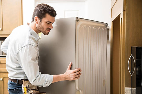 young-man-working-as-electrician-exposing-back-fridge-check-repair-it_662251-2712.jpg