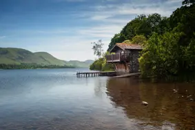 A calm evening at The Duke of Portland Boathouse and is located on the northern banks of Lake Ullswater in the Lake District, near Pooley Bridge, Cumbria.