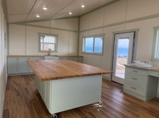 A large kitchen with a wood island
