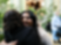 a woman hugging her friend