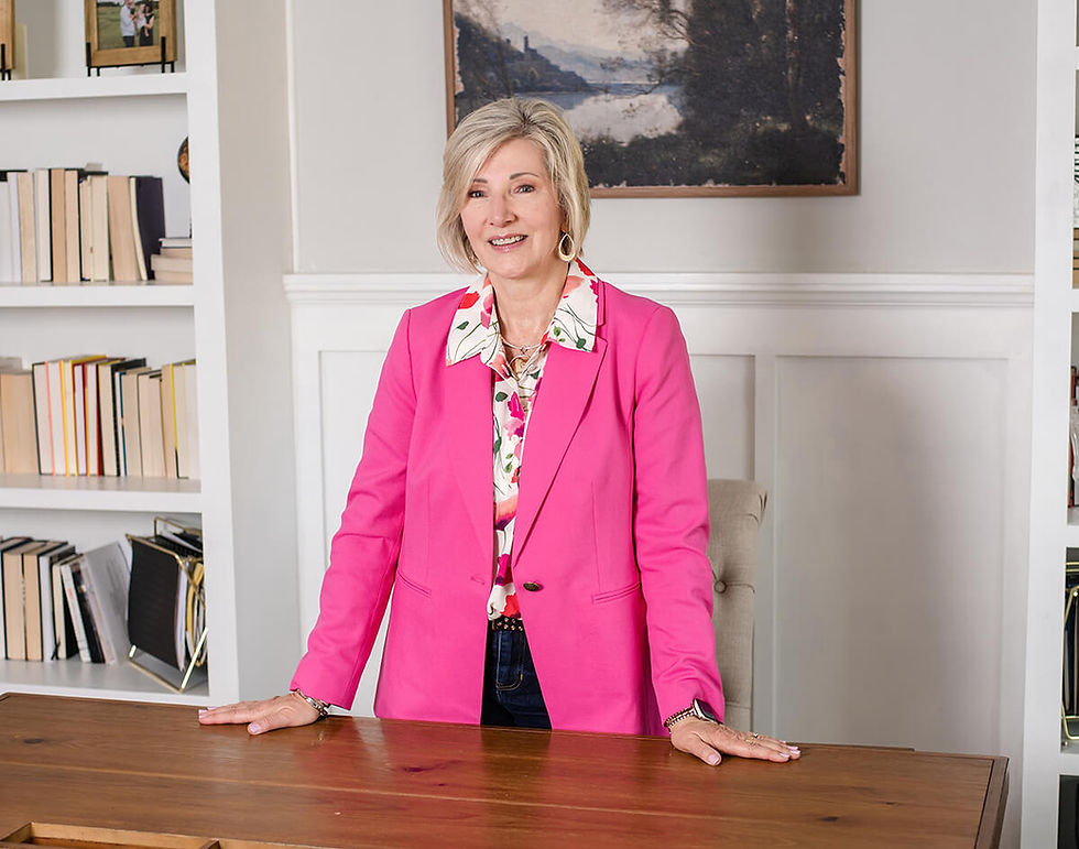 Karrie Ingalsbe, standing by leadership books - El Paso, IL