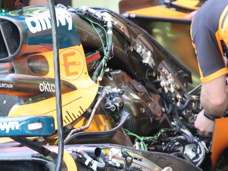 Close-up of McLaren’s 2026 MCL40 rear bodywork and Mercedes HPP power unit, highlighting cooling, exhaust, and suspension architecture used in the Miami Grand Prix.