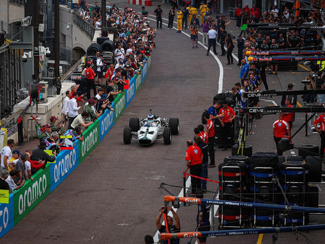 McLaren's historic M2B runs through the Monaco pit lane during the team's 1000th Grand Prix celebrations in 2026.