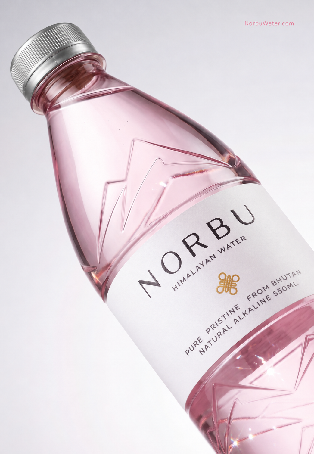 NORBU pink bottle in a considered diagonal composition