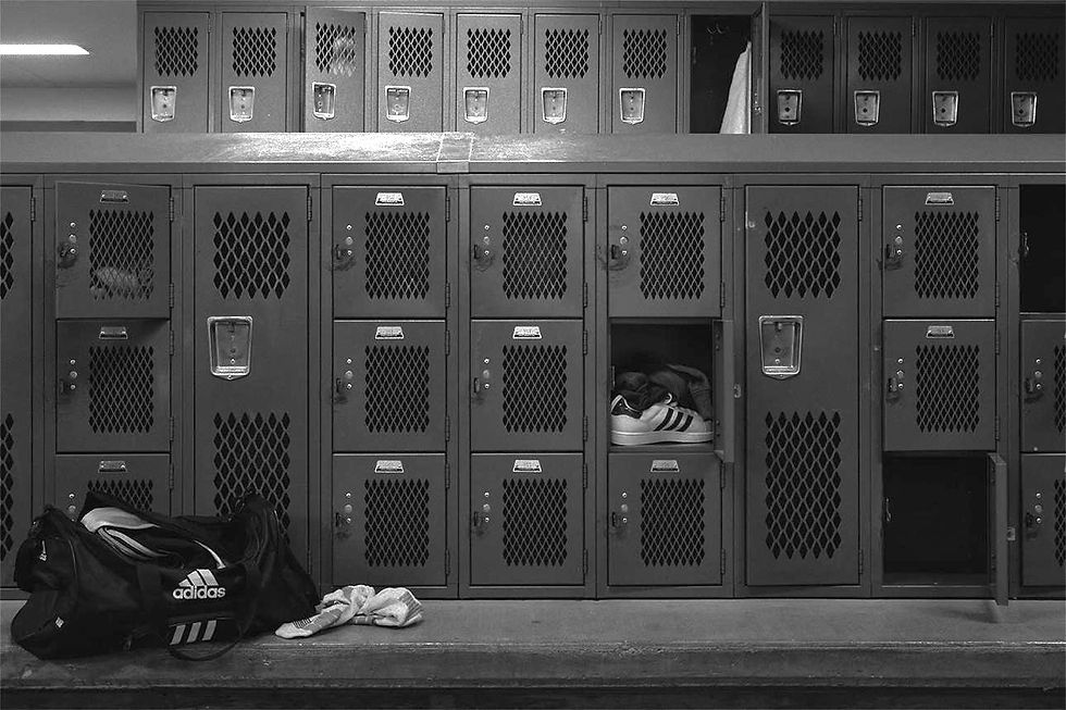 An empty locker room symbolizing the need to cut a character from a team, or rather, a novel
