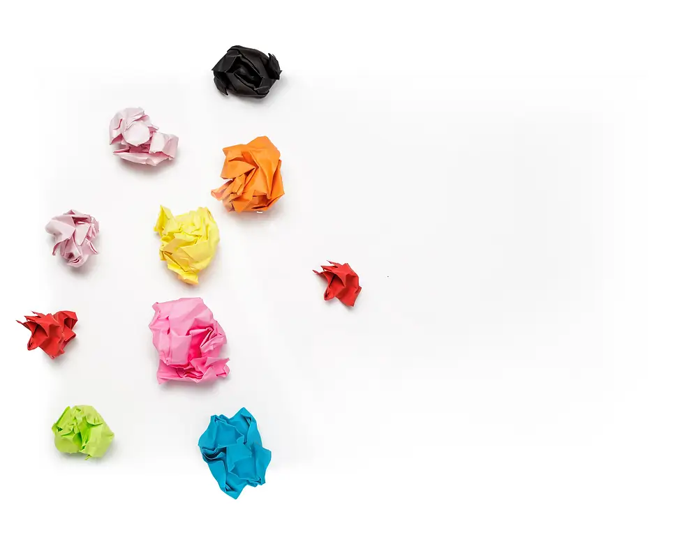 colourful scrunched up pieces of paper on white background