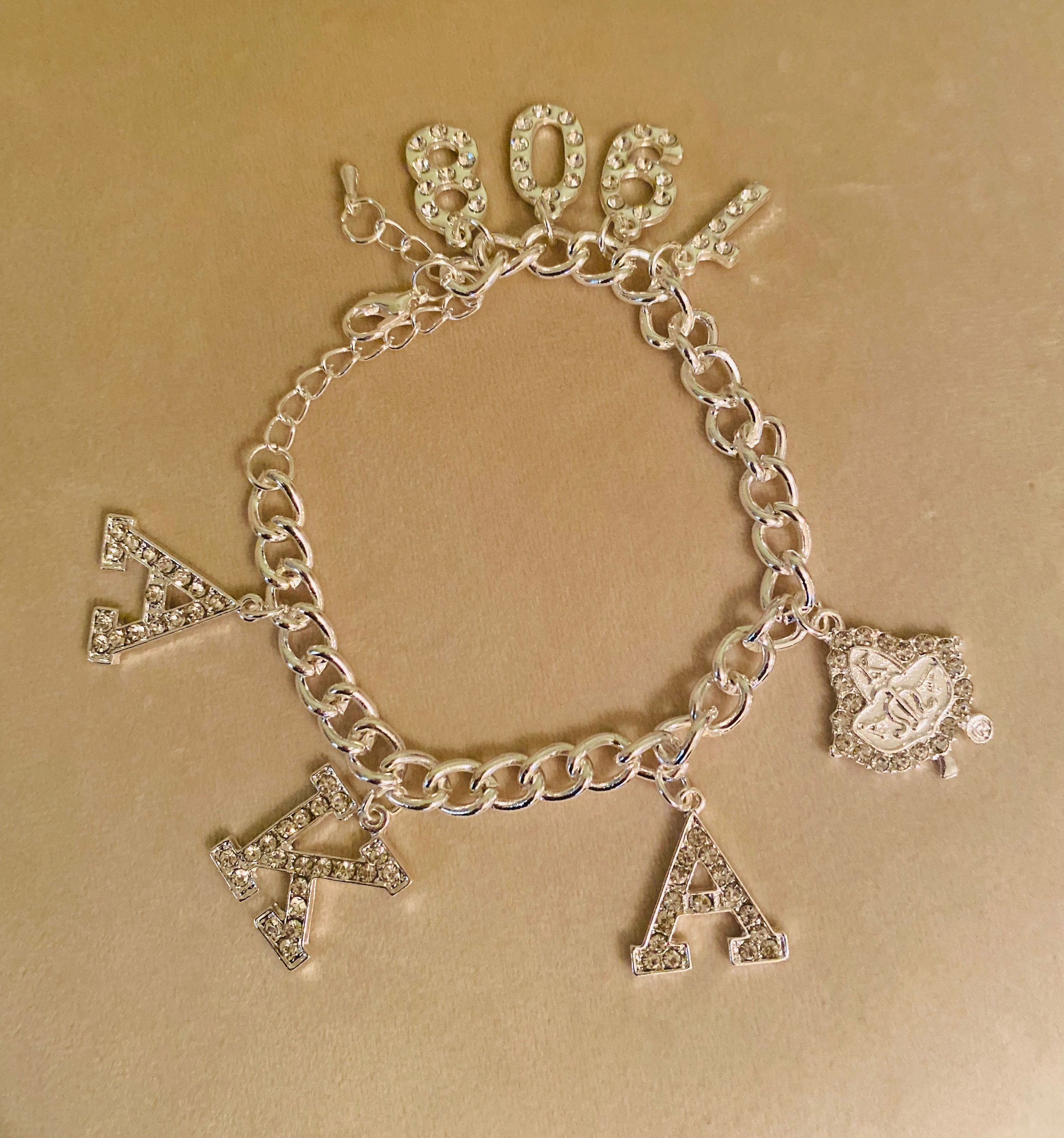 AKA Austrian Crystal Charm Silvertone Bracelet 