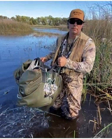 Thumbnail: loading 1 dozen duck decoys into the Texas Rig Duck Decoy bag