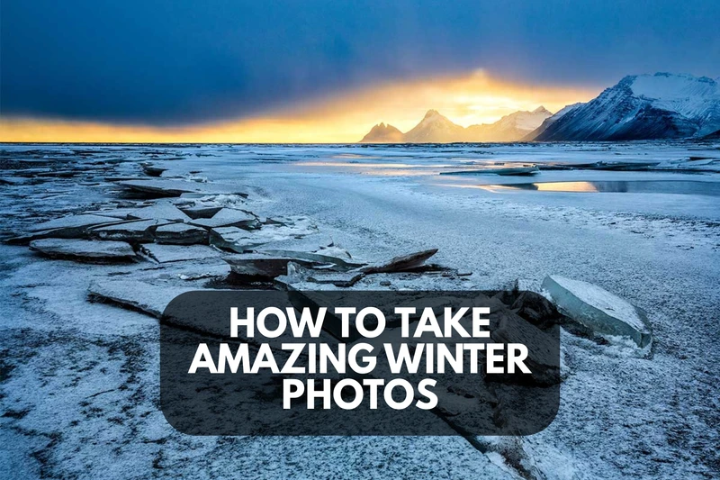 a snowy mountain with a sunset in the background