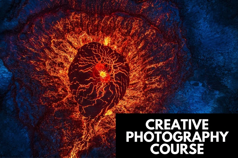 an aerial view of a volcano with lava coming out of it