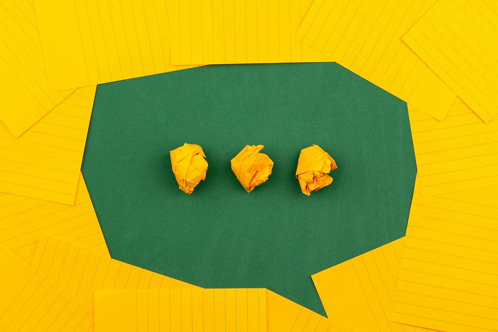 photo by Volodymyr Hryshchenko image of a chat bubble with three dots made of collaged paper