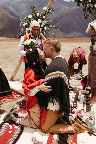 Couple embracing after a Huywarikuy Andean wedding ritual in the Sacred Valley of Peru