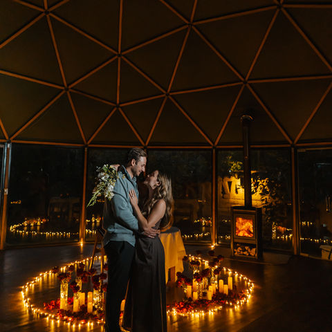 Couple embracing during a private proposal inside a geodesic dome in Ollantaytambo Sacred Valley