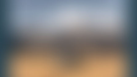 Man proposes to his partner in the Sacred Valley of Peru, framed by a floral hoop with snow-capped Mount Chicon and dramatic Andes mountains in the background.