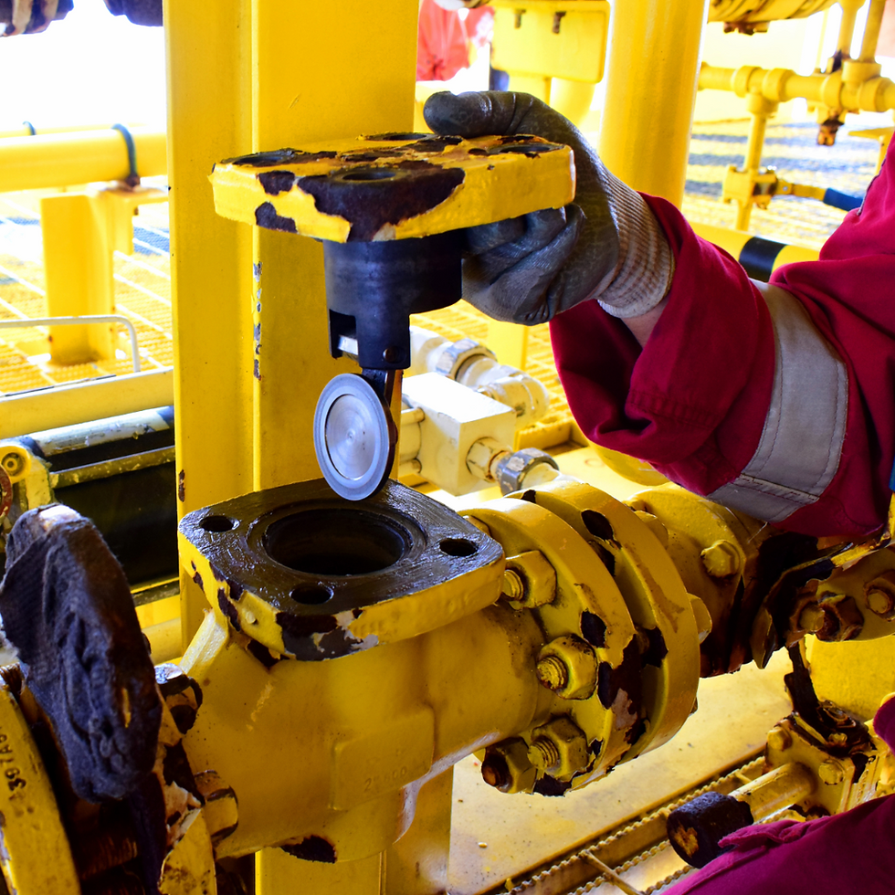 photo of a yellow sump pump being checked by a technician