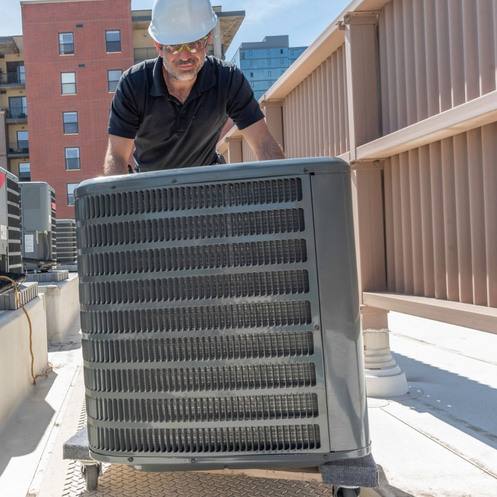 an HVAC tech rolling on an ac replacement unit on a dolly