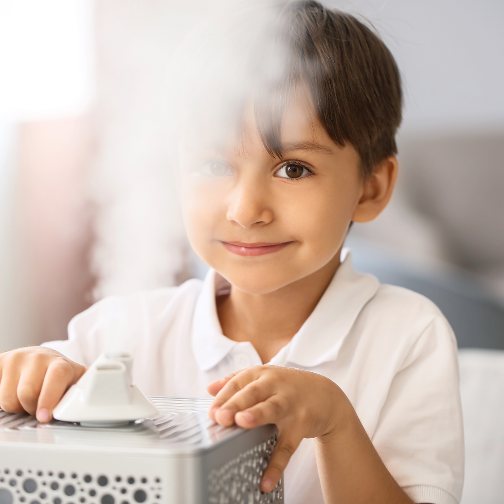 a boy near a home humidifier