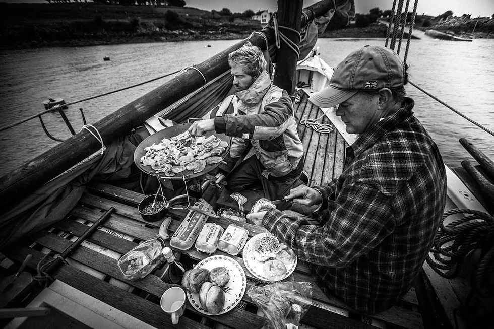 The crew cooking dinner on Barnabas. © Chris Yacoubian
