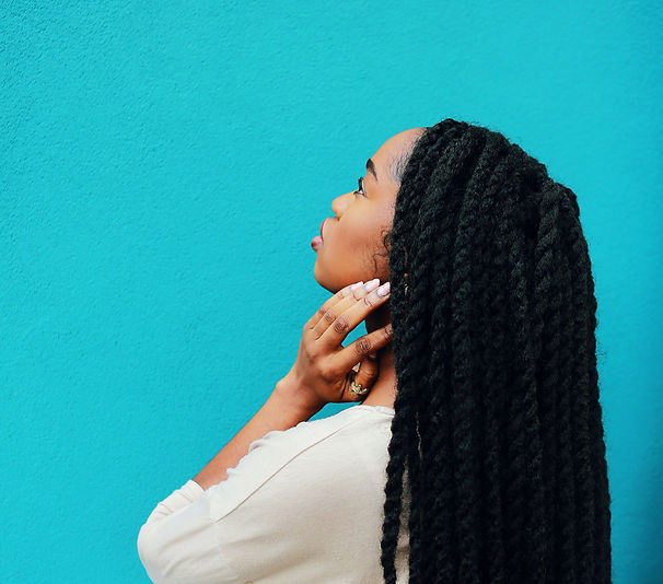 woman-holding-neck-staring-on-wall-16618