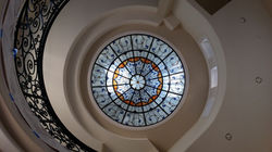 Blue and orange ringed dome with vines radiating out from the center