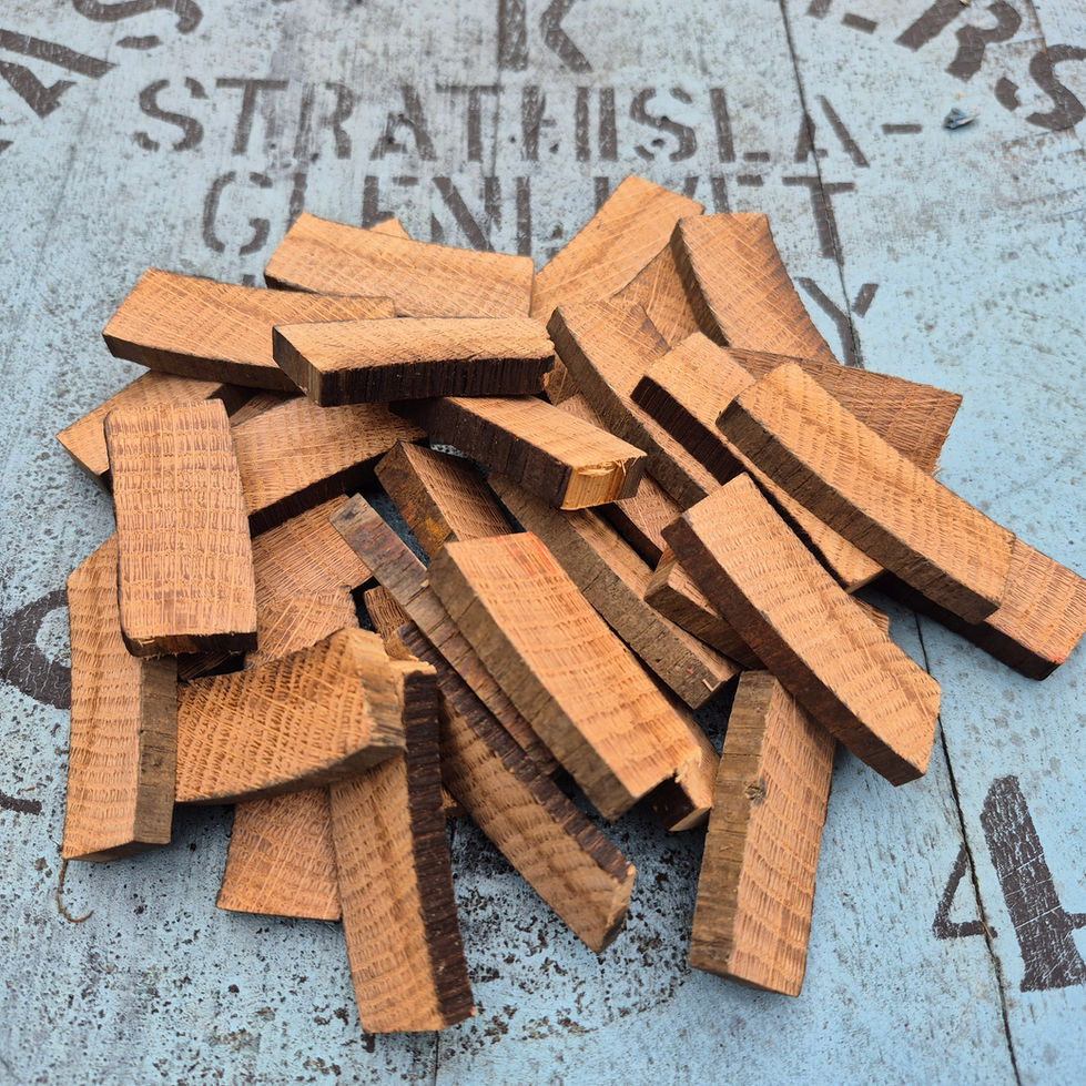 Close view of rough-cut Strathisla 1976 barrel stave pieces with original source-cask markings