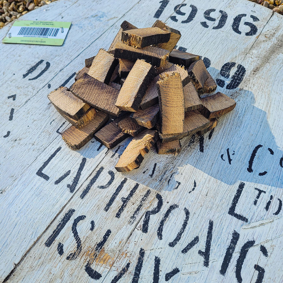 Close view of rough-cut Laphroaig 1996 barrel stave pieces with original source-cask markings