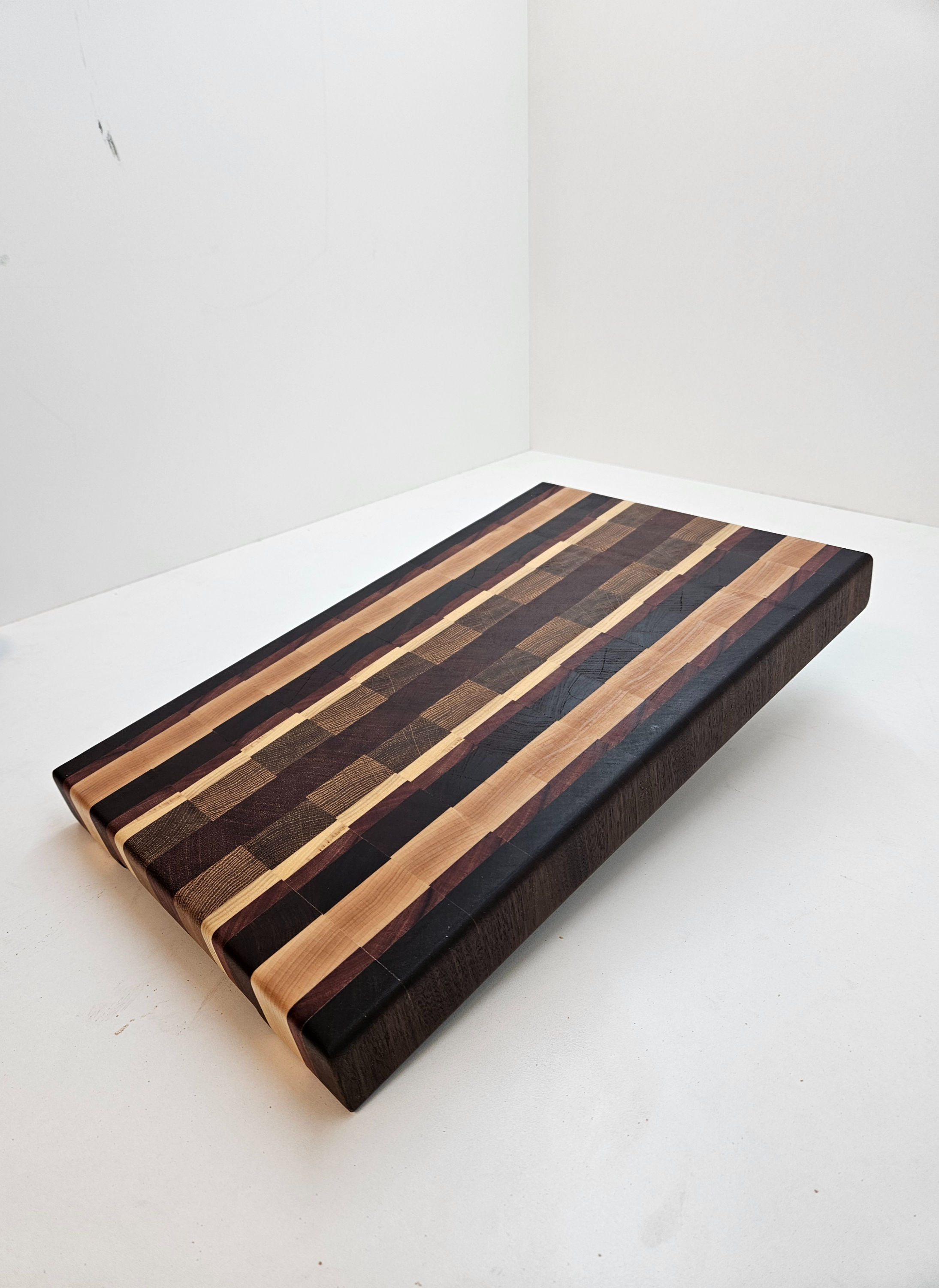 Custom wood species end grain cutting board