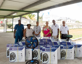 Donation of 34 fans to NEC June 6th 2023_Left to right are Principal Damani-Fox, Michelle 