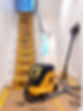 Dustless sanding equipment with walls in the background sanded to smoothness