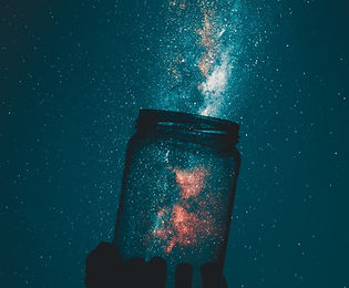 silhouette-of-person-holding-glass-mason