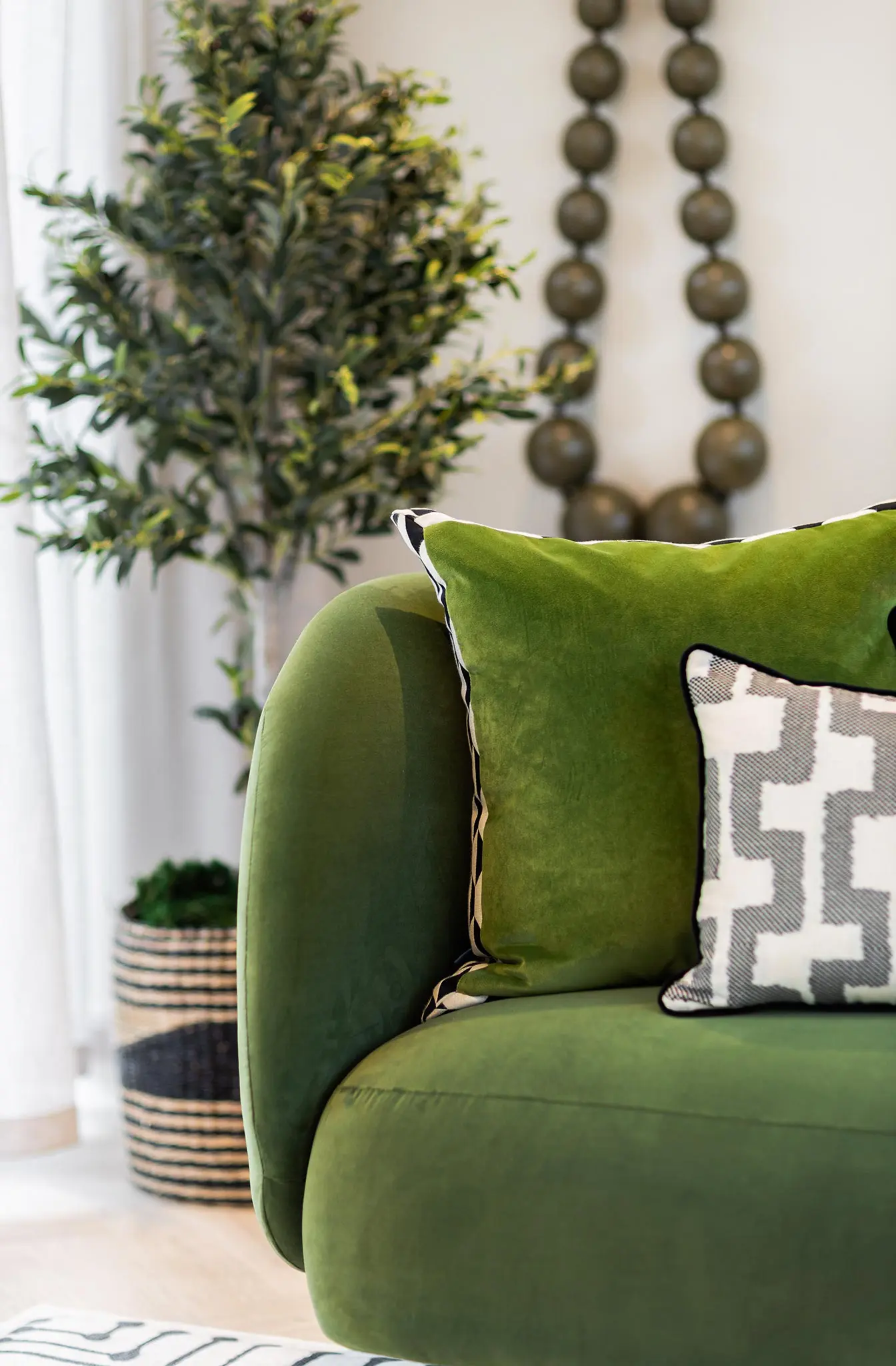 Luxury Interior Design Family Home Open plan NSD Studio Hampshire Nick Snow design kitchen worktops island pendant lighting details Surrey Hampshire green sofa living space foliage accessories cushions