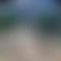 Spacious interior of a conservatory wedding structure rental with dining, lighting, and live entertainment