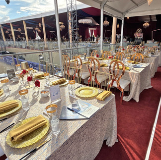 Guest seating with arena view, gold tableware, and luxurious decor at Las Vegas Arabian Champions event.