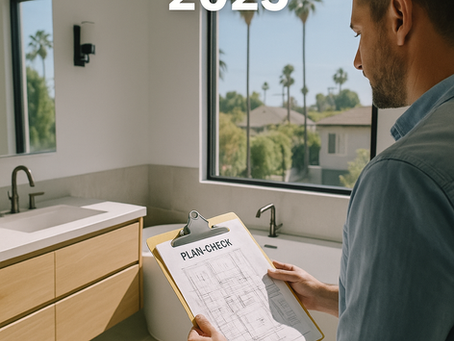 A contractor reviews a “PLAN-CHECK” document on a clipboard inside a bright Los Angeles bathroom with palm trees visible through the window and overlay text reading “Avoid LADBS Errors 2025.