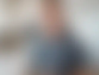 Experienced Los Angeles general contractor with plans in hand, standing in a newly renovated kitchen.