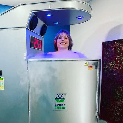 Smiling person in Space Cabin cryotherapy chamber