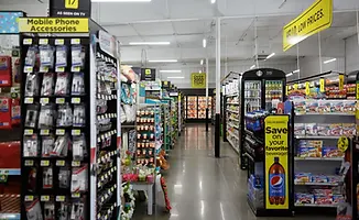 Retail store aisle with mobile phone accessories and drinks