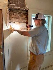 Craig Jacobs examining one of the original logs