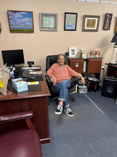 Woman sitting at a desk in her office