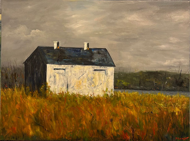White shack painting amidst golden marsh grass under a cloudy sky.