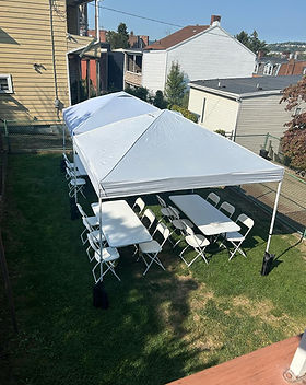 Birdseye view of tent, table, and chair setup in Pittsburgh backyard