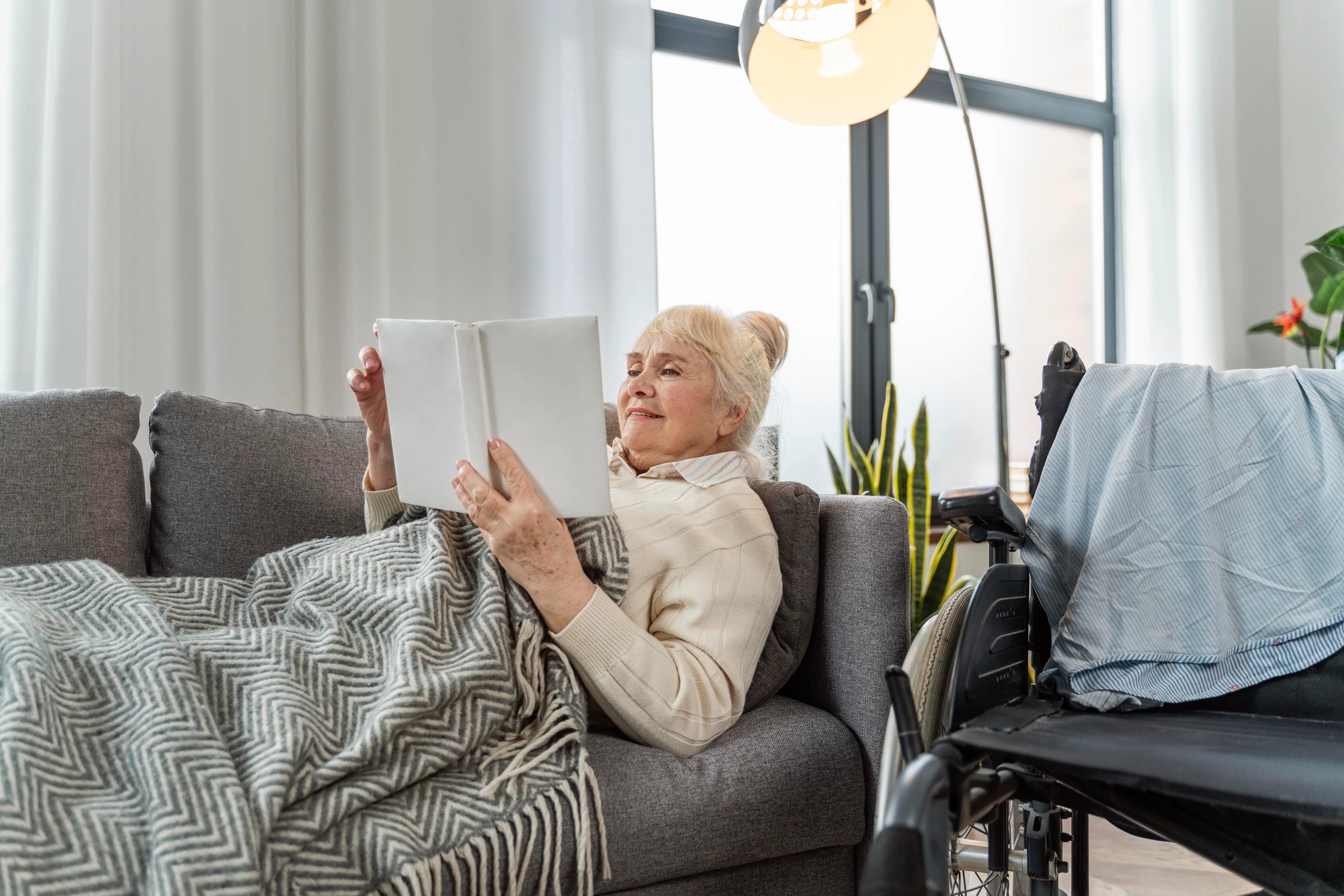 senior-woman-lying-bed-wheelchair_.webp