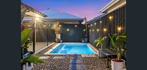 Compact 5.0 x 2.5m swimming pool designed for small yards, featuring a built-in bench, sky blue pebblecrete interior, and elegant porcelain coping for a modern finish.
