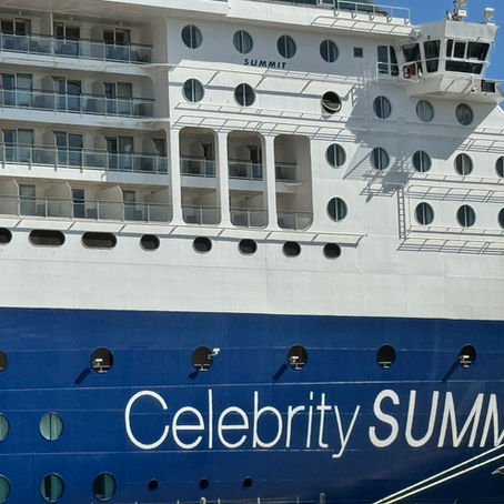 Celebrity Summit cruise ship exterior docked at port showing ship name and balcony cabins