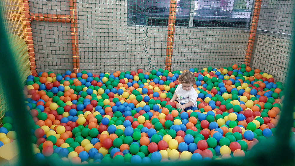 Child playing with balls