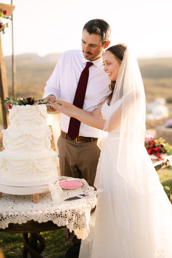 St. George, Utah wedding photography cutting wedding cake at Hidden Springs RV Resort