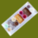 Close-up view of a brownie bar with various toppings arranged neatly