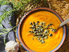 A picture of a bowl of soup made from a traybake with garlic and rosemary