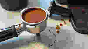 Freshly ground tamped compressed coffee in portafilter