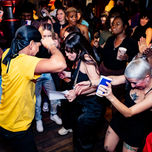 Energetic dance moment with participants of various backgrounds enjoying movement.